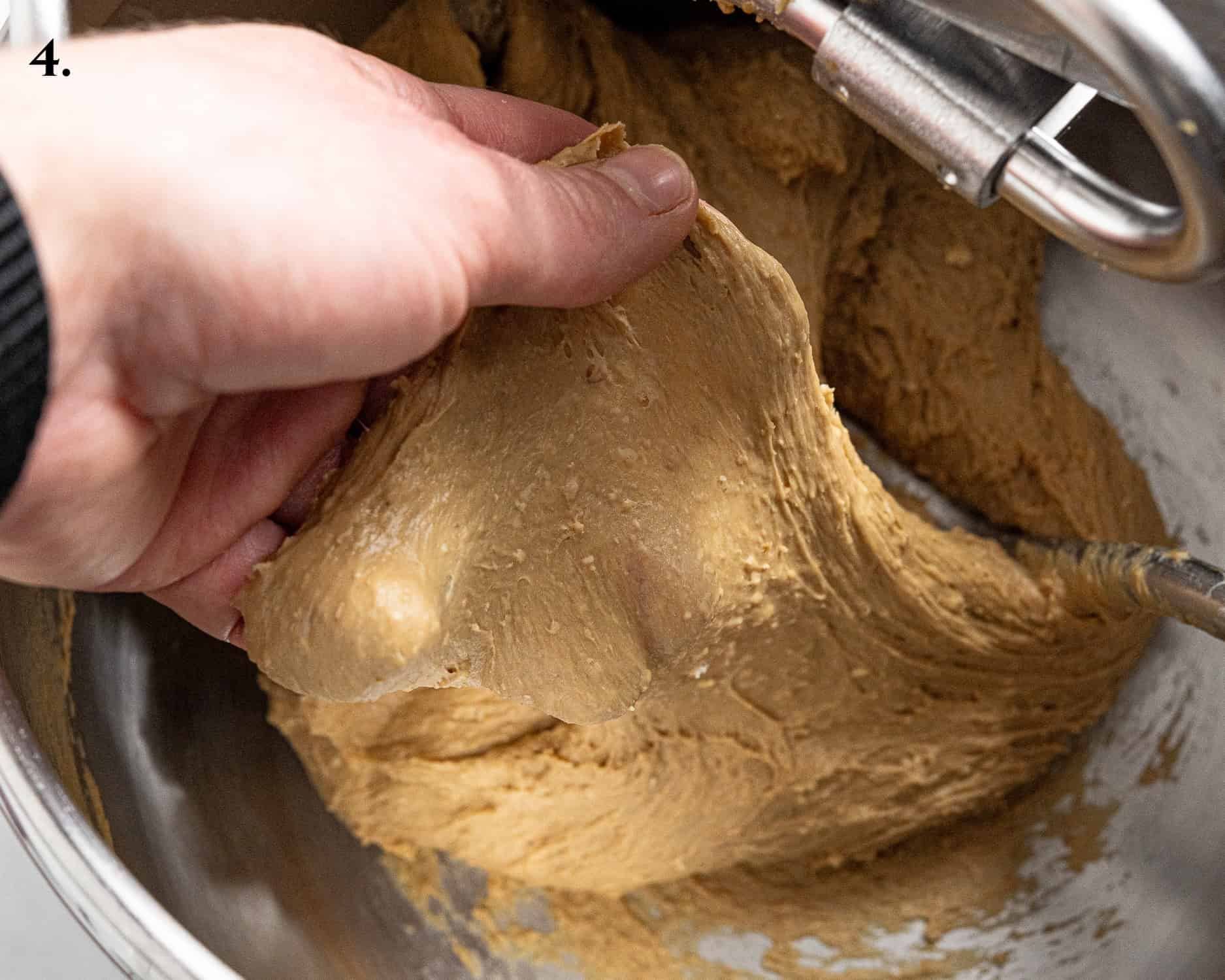 Step 4, a hand stretching a portion of the dough.
