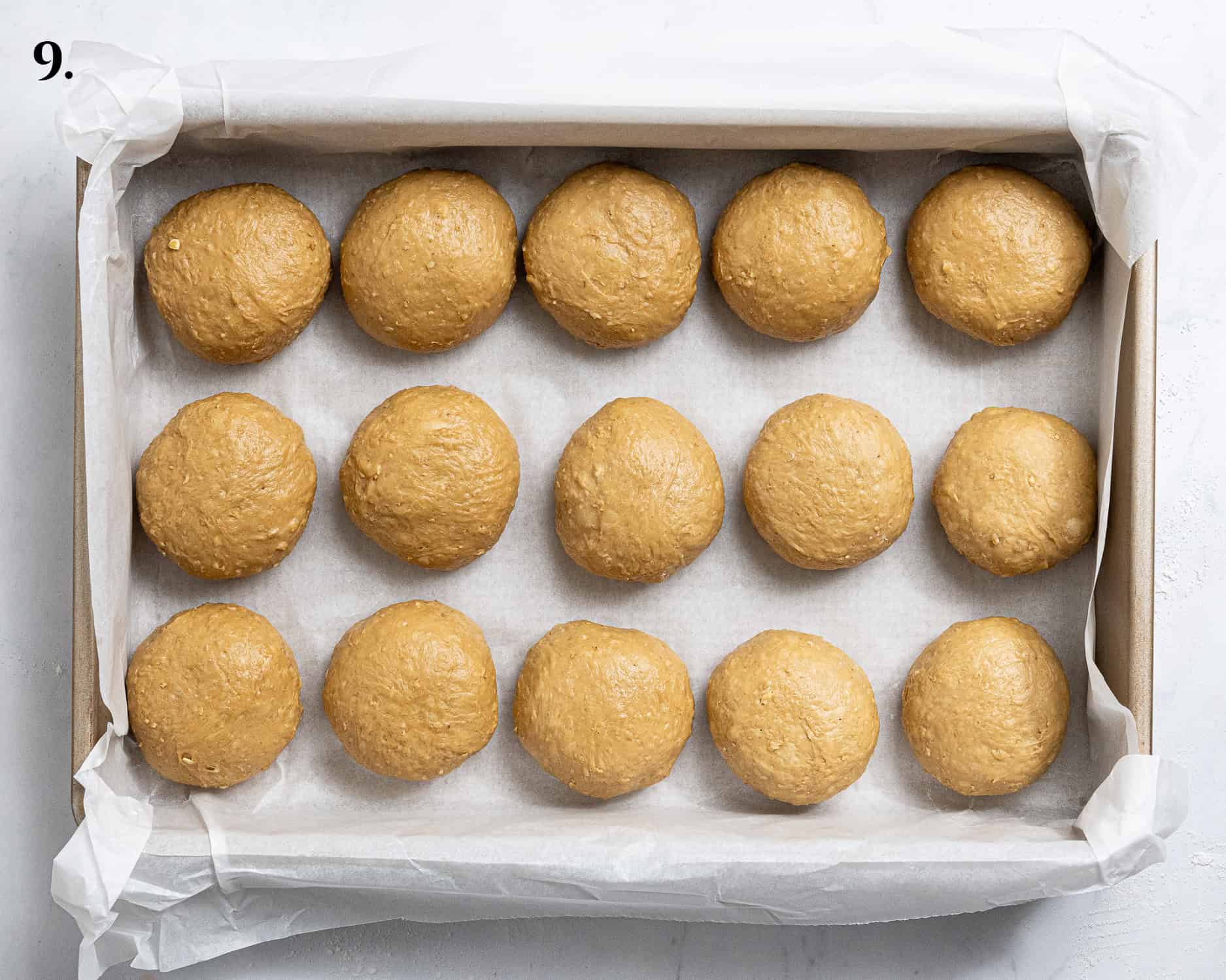 Step 9, the dough balls in the tin before rising.