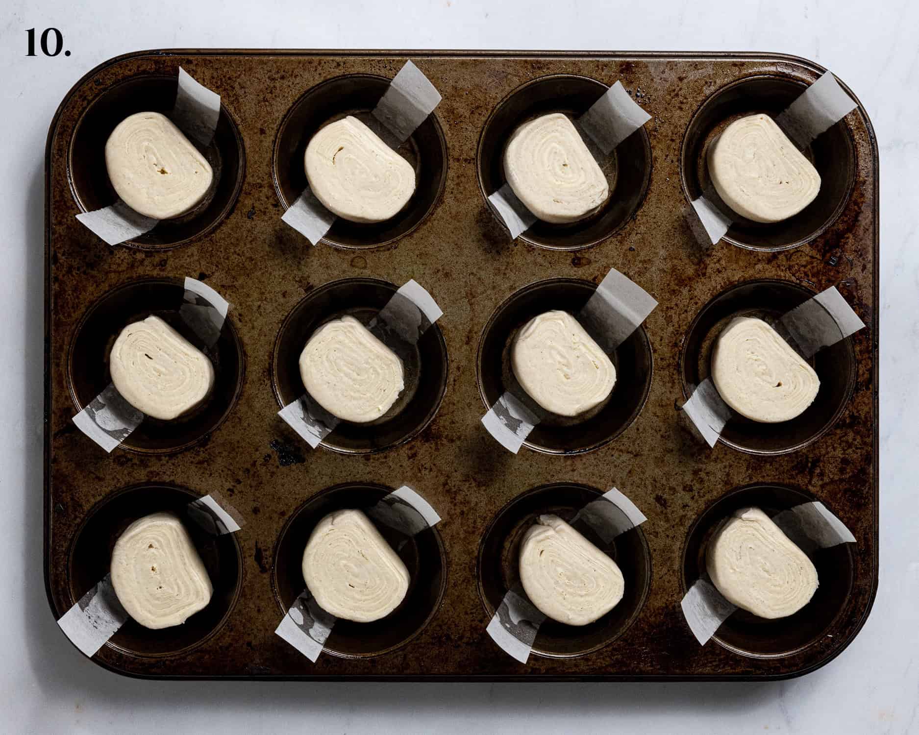 Step 10, the pastry slices in the muffin tin.