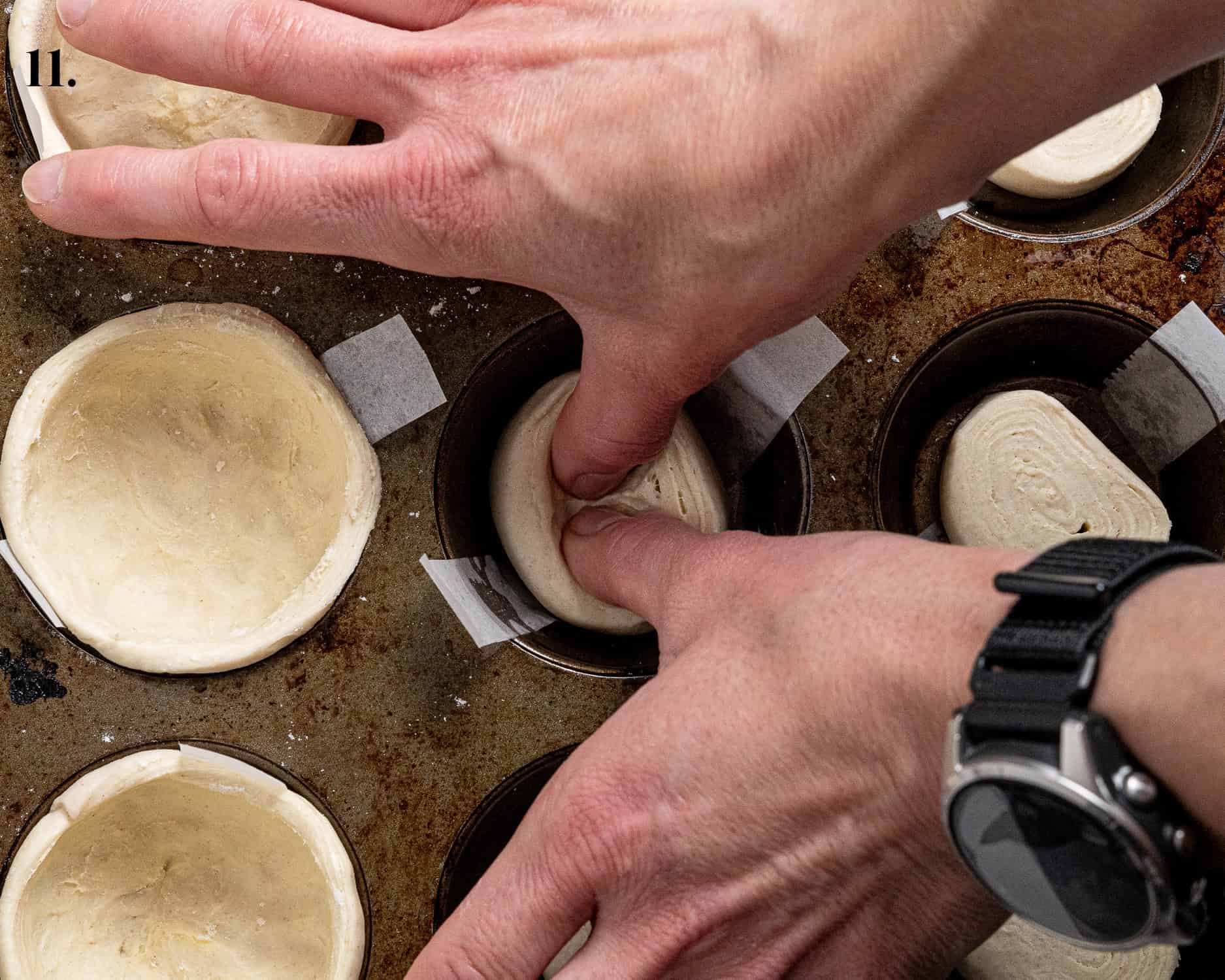 Step 11, a pair of hands pressing the pastry down.