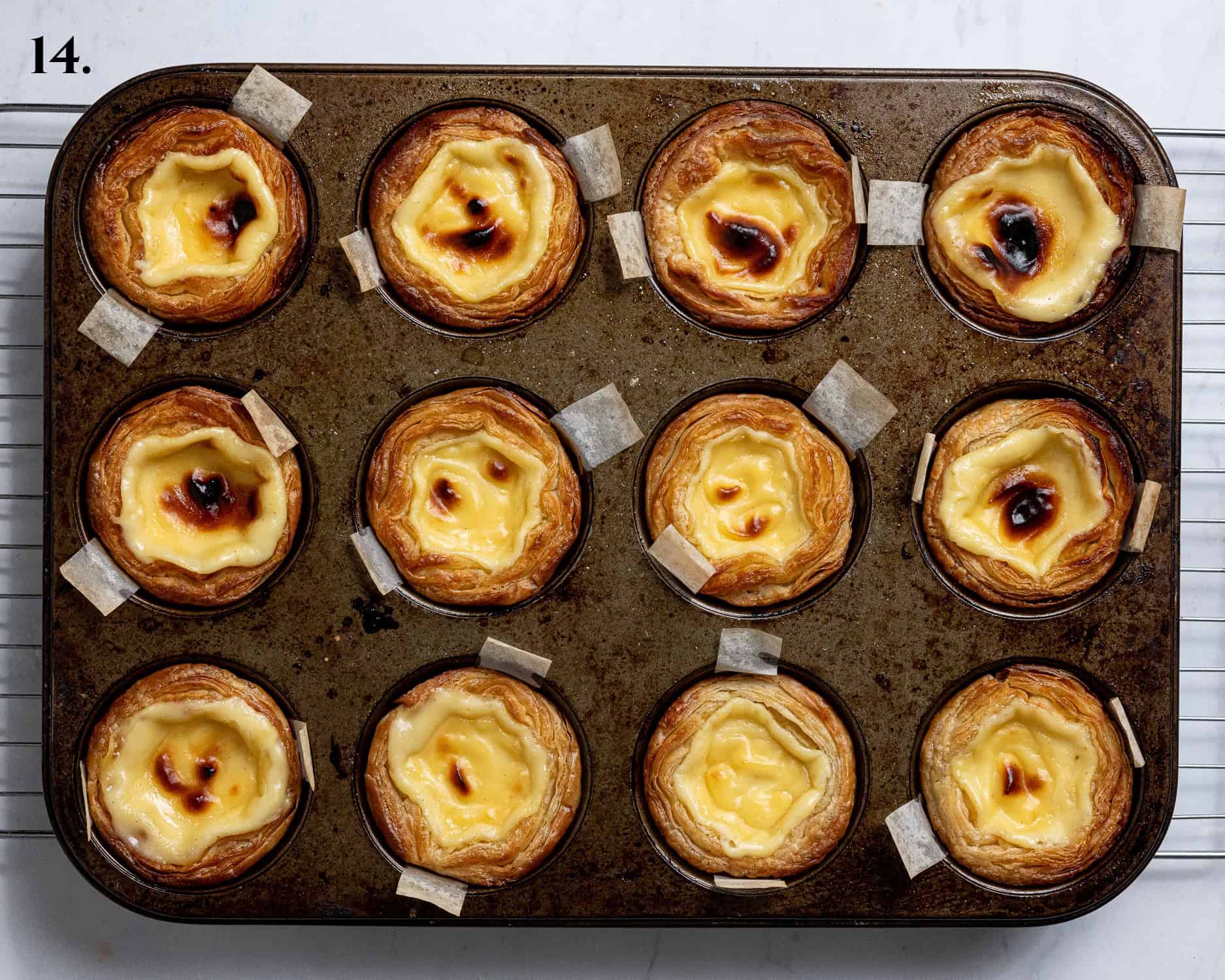 Step 14, the baked pasteis de nata in the tin.