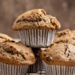 Close up shot of a stack of vegan zucchini muffins.