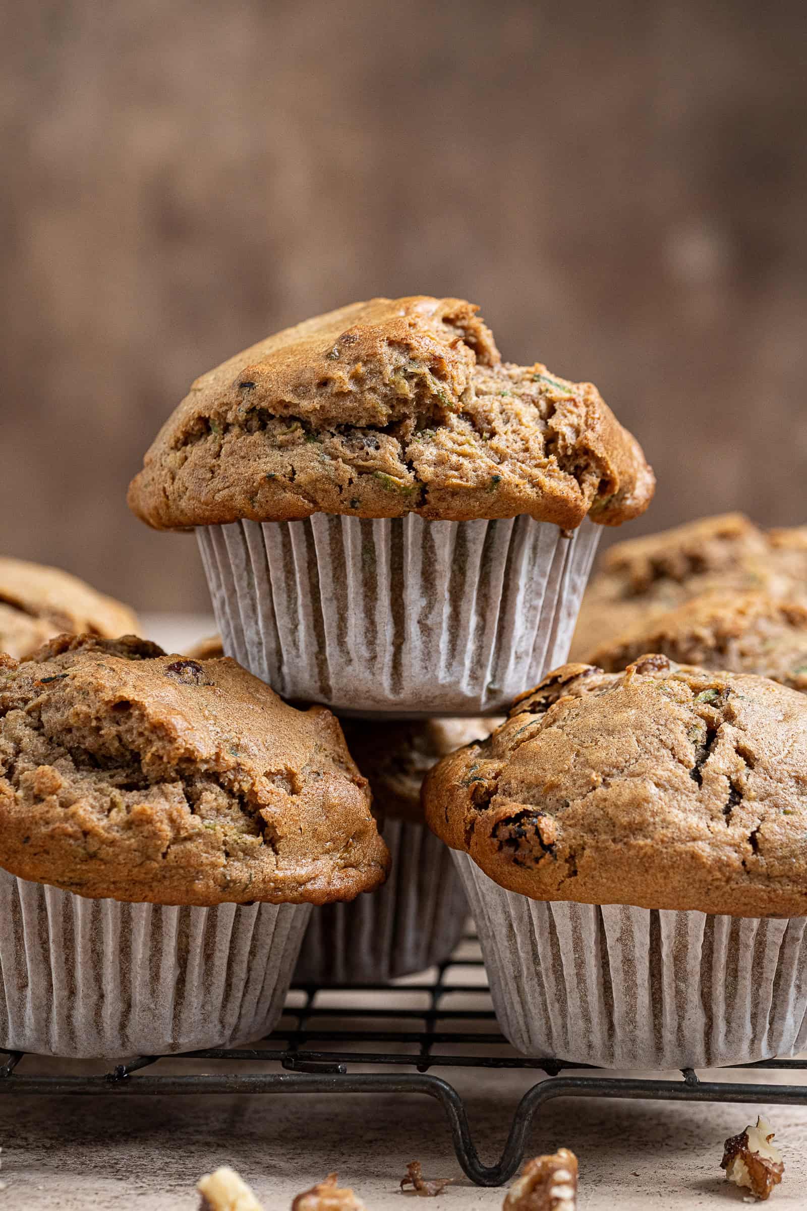 Close up shot of a stack of vegan zucchini muffins.