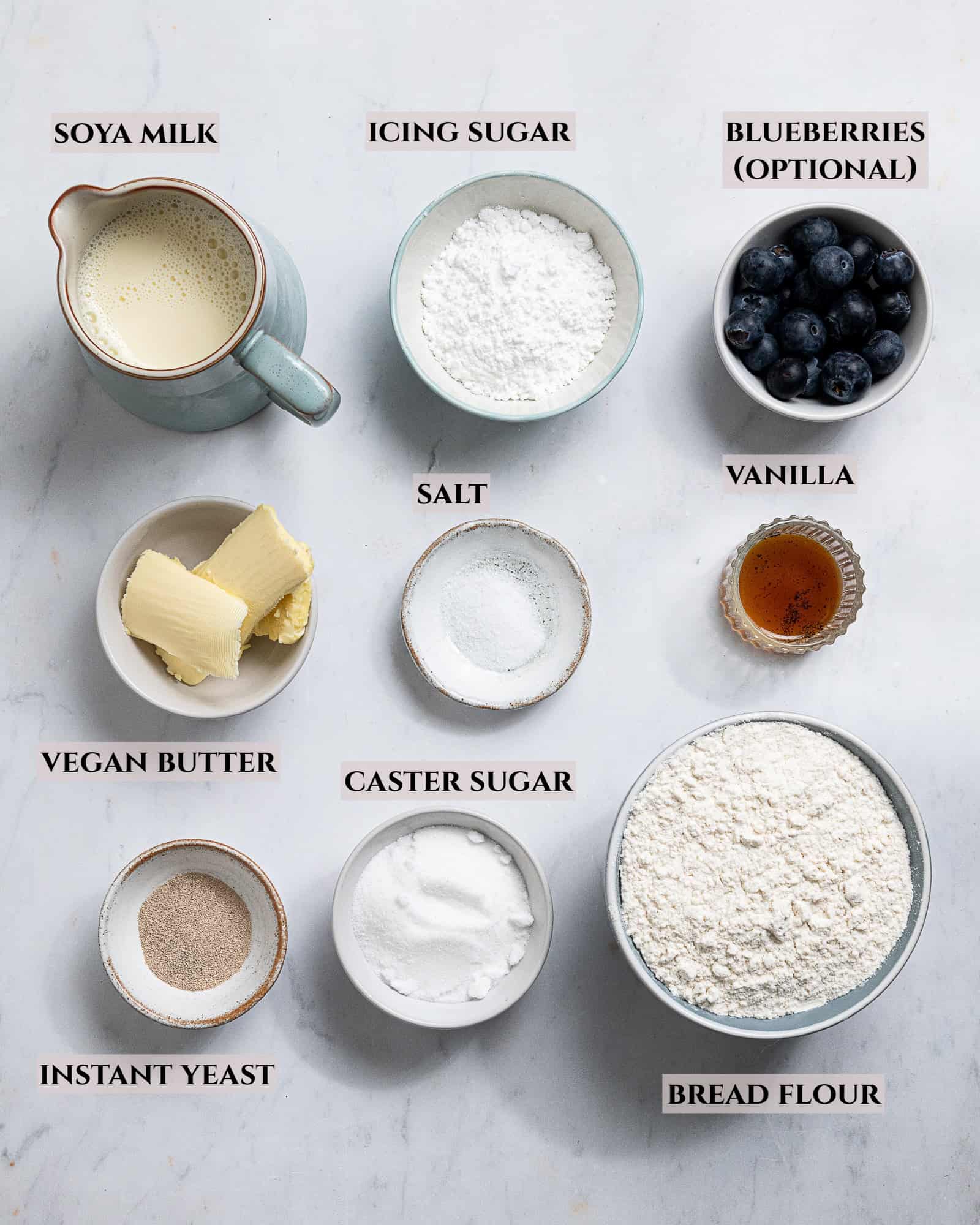 A labelled photo of the ingredients needed to make vegan iced buns.