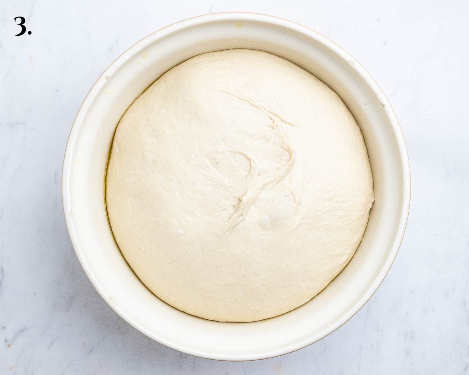 Step 3, the risen dough in a bowl.