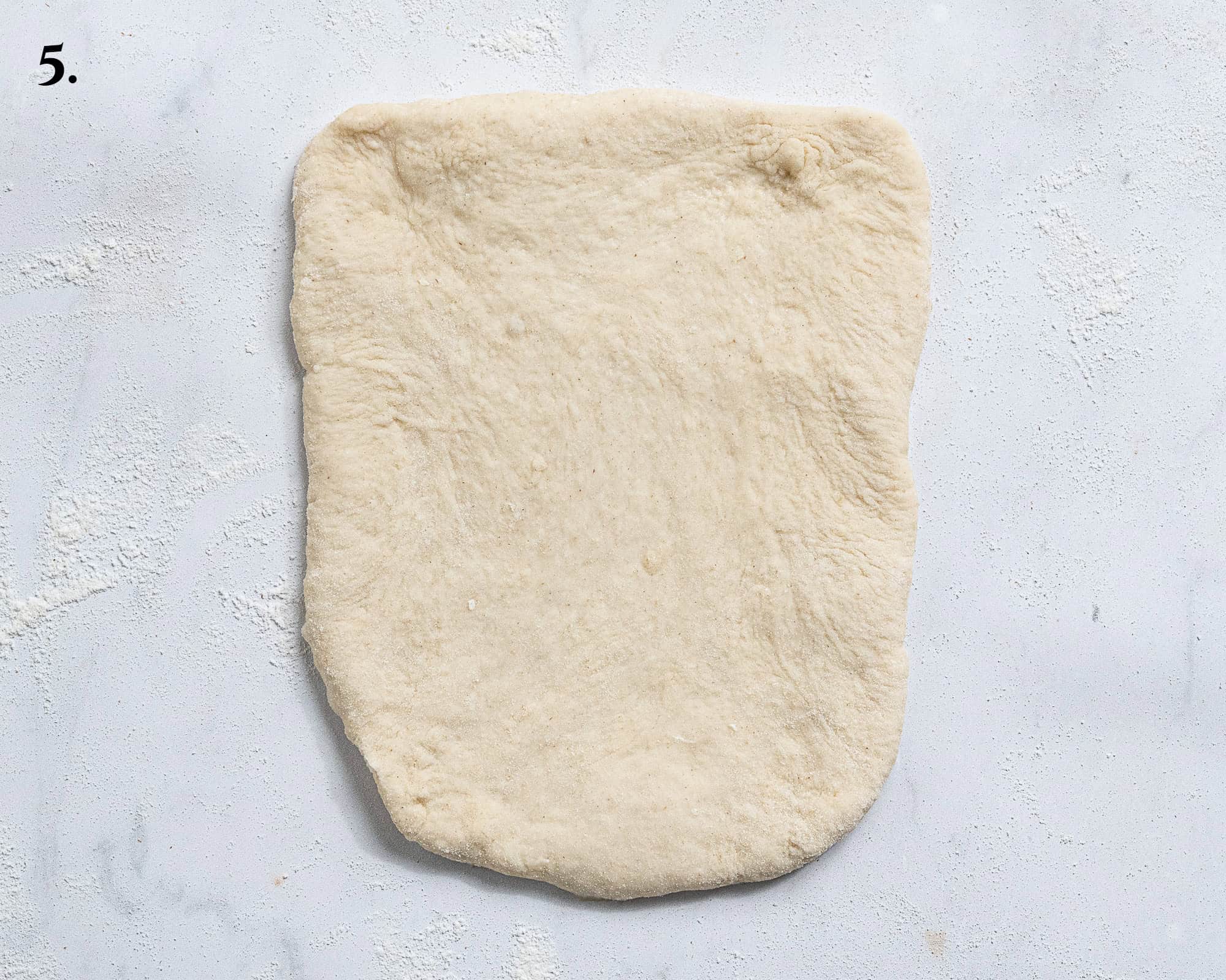 Step 5, one of the balls of dough rolled out into a rectangle.