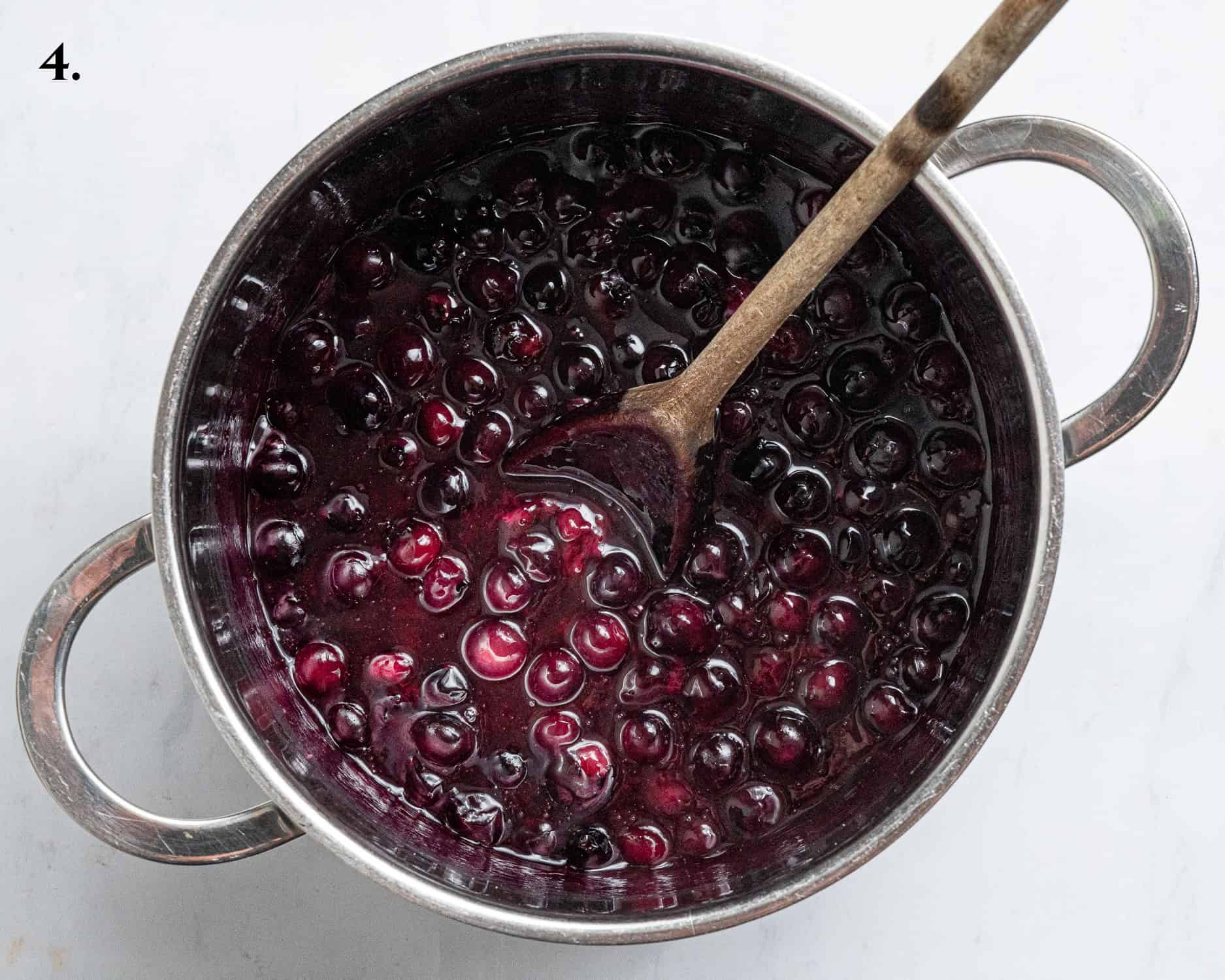 Step 4, the cooked blueberry compote in a pan.