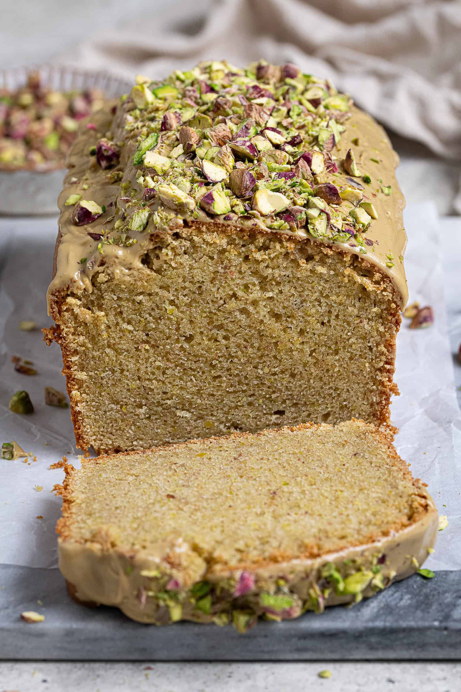 Close up shot of the sliced pistachio loaf cake.