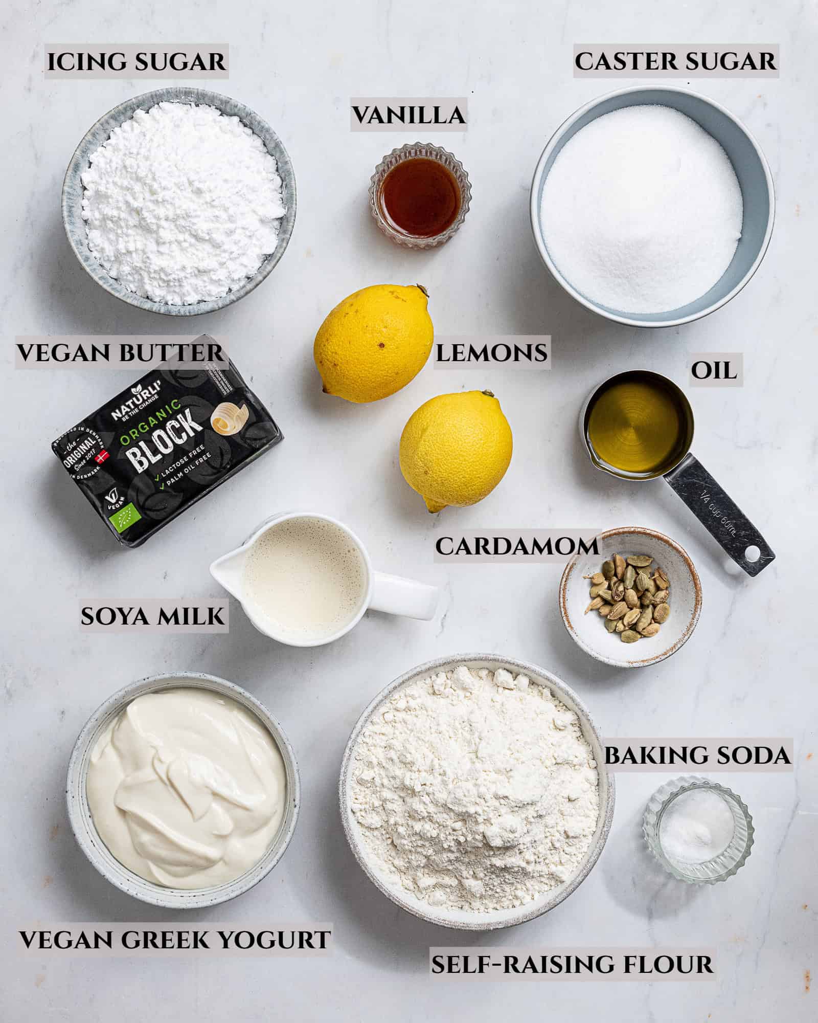 A labelled photo of the ingredients needed to make vegan lemon cardamom pound cake.