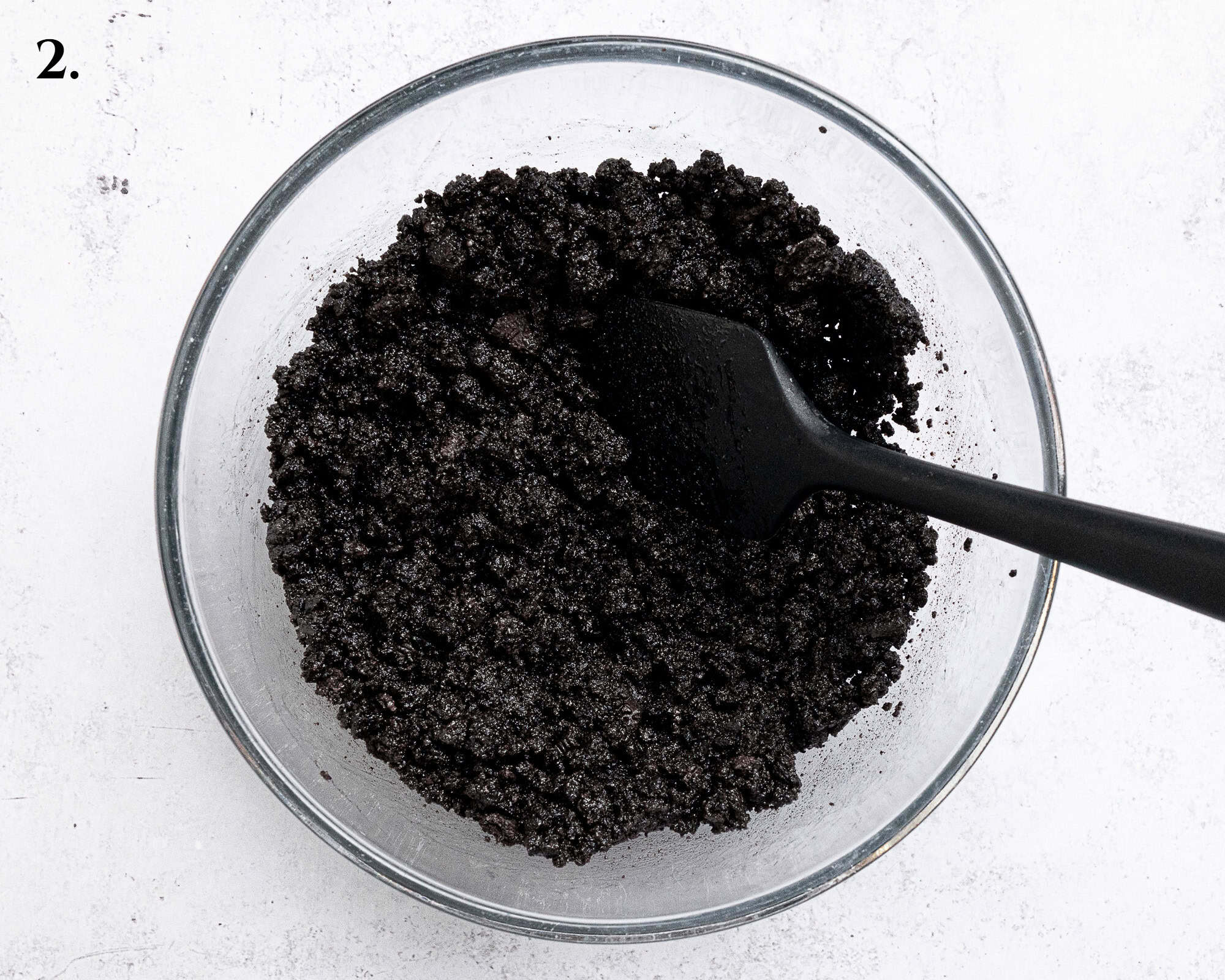 Step 2, the cookie crumbs mixed with melted butter.