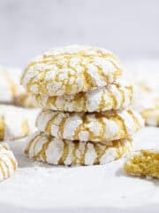 A stack of vegan lemon crinkle cookies.