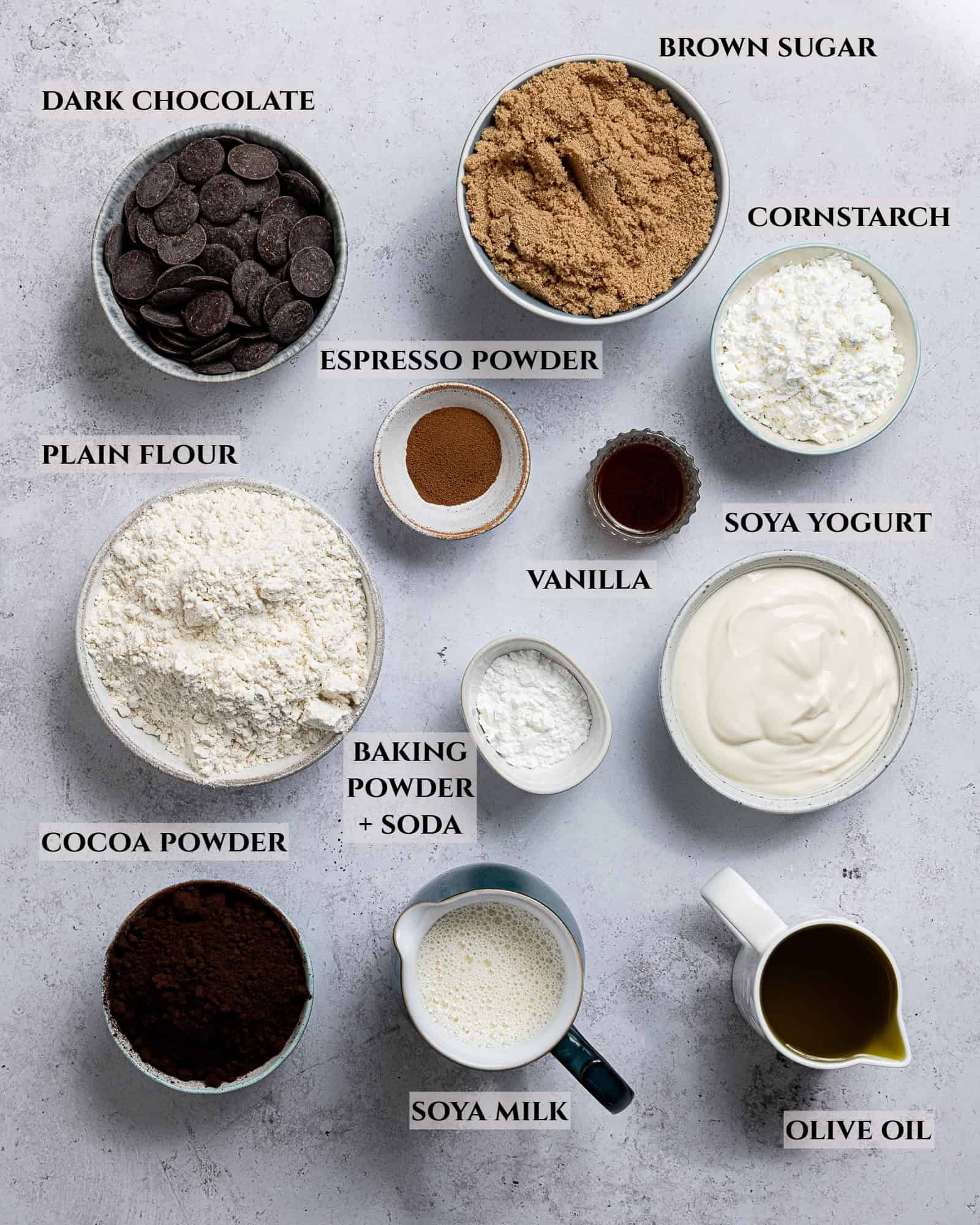 A labelled photo of the ingredients needed to make vegan Brooklyn blackout cake in bowls.