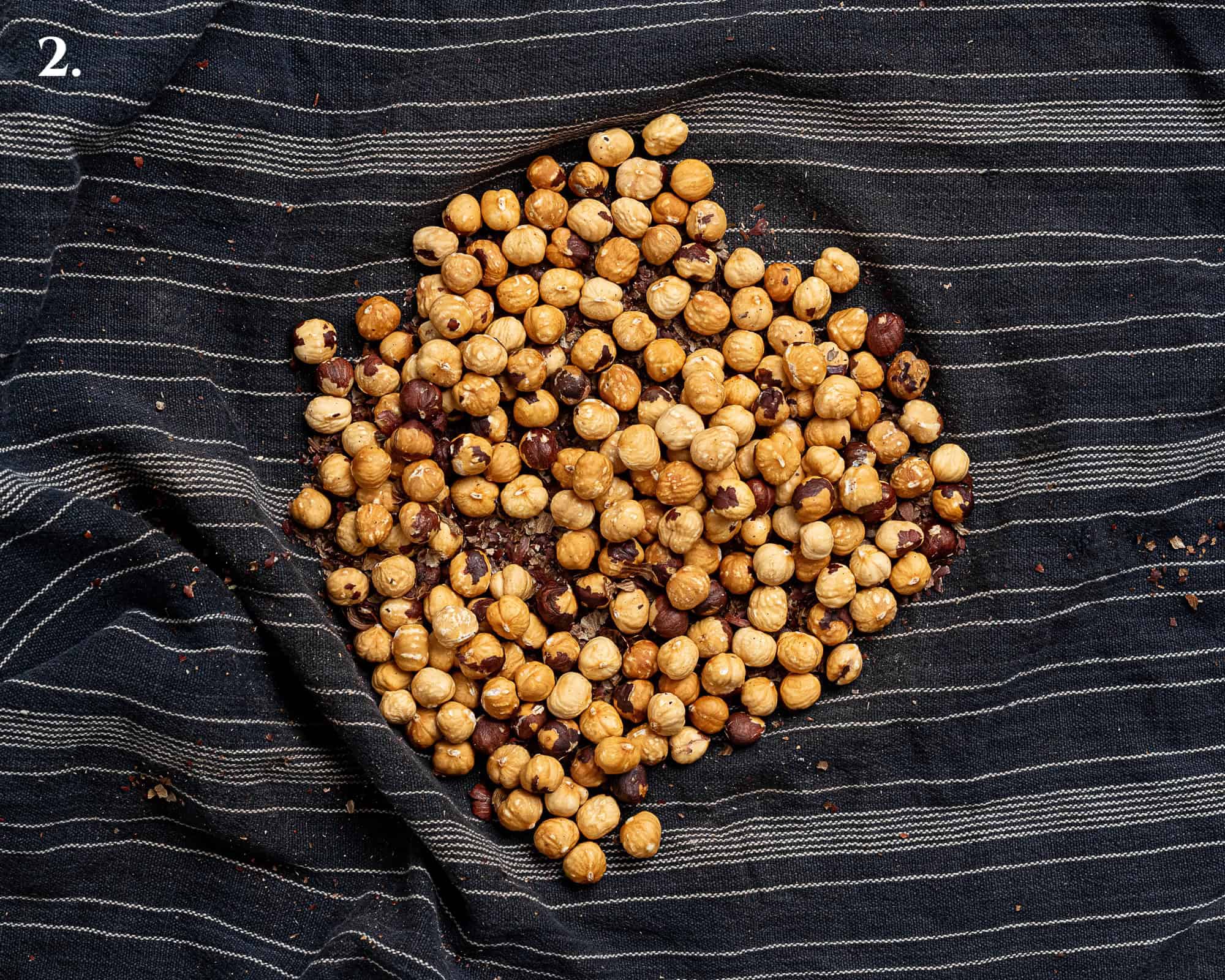 Step 2, the skinned hazelnuts in a tea towel.