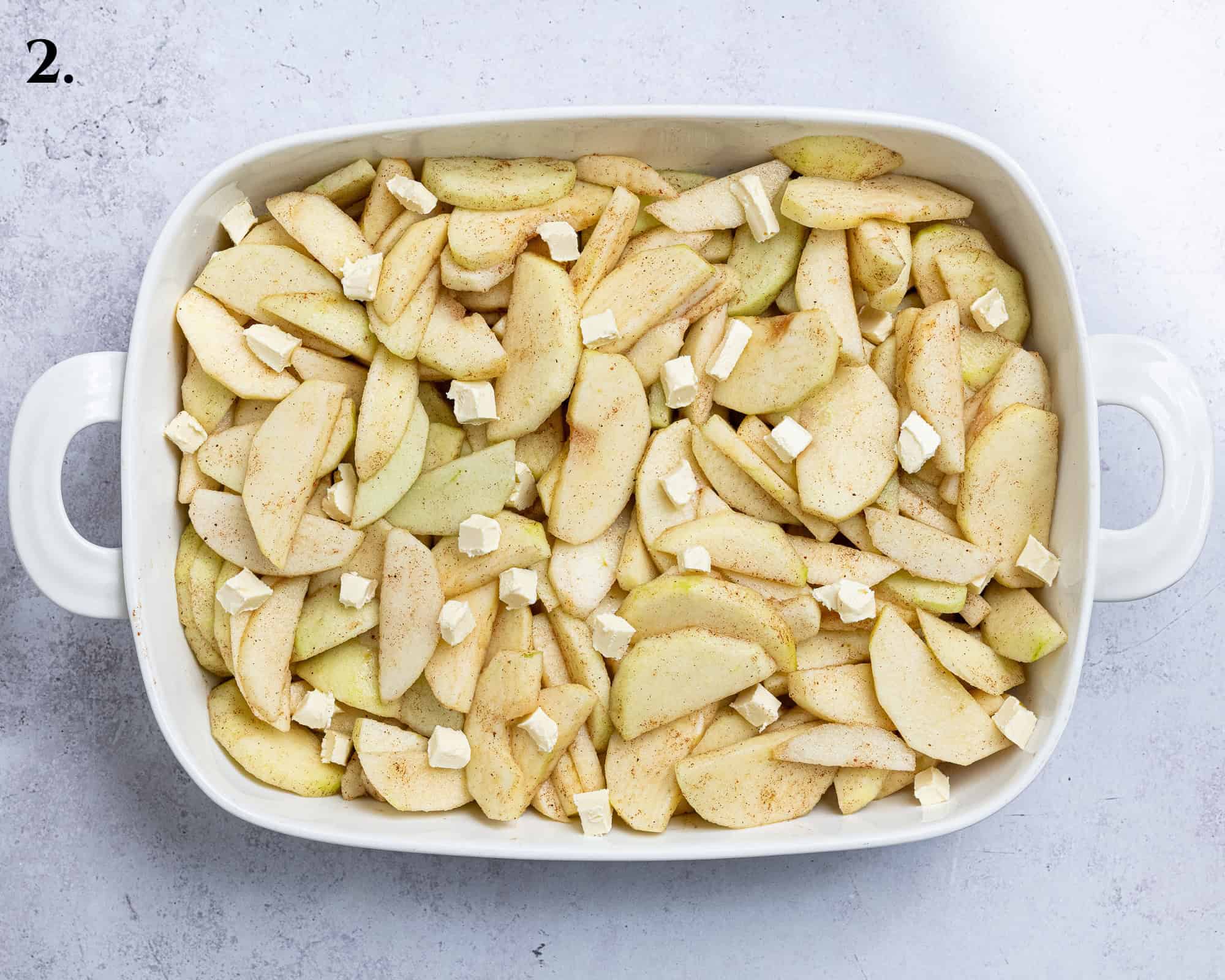 Step 2, the apples in the baking dish topped with the butter.
