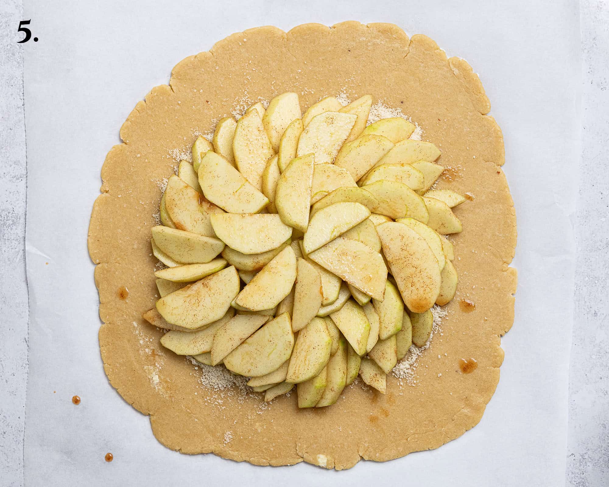 Step 5, the apple slices arranged on top of the pastry.