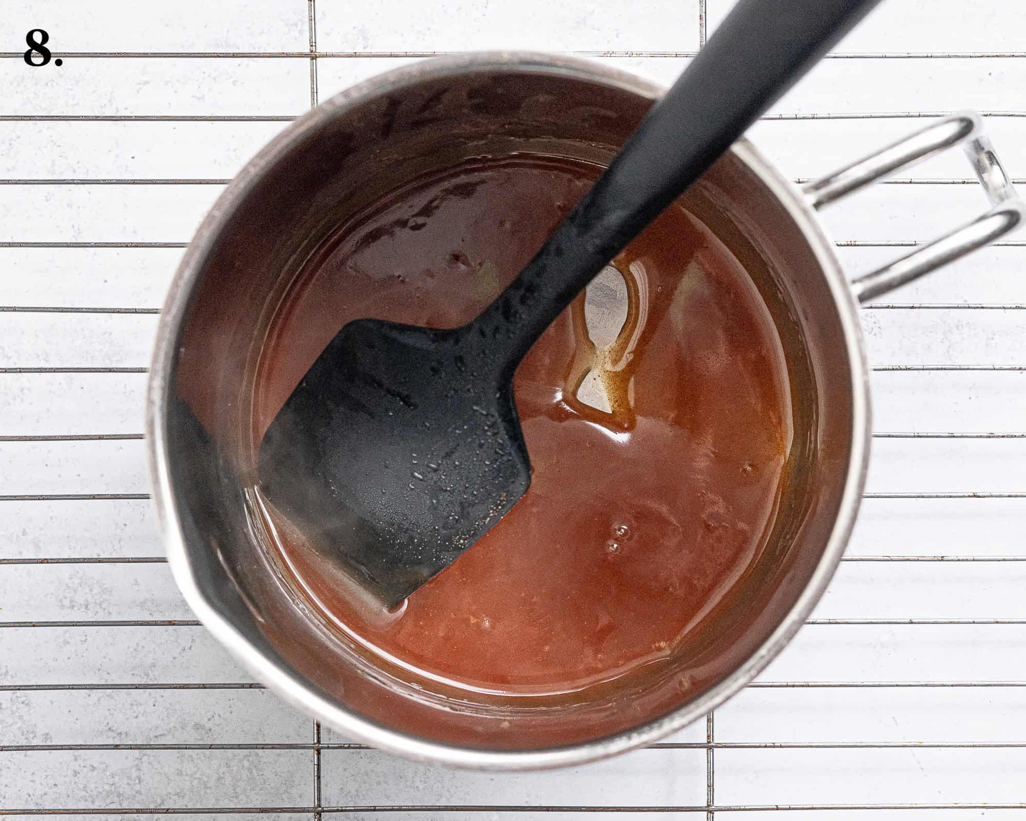 Step 8, the thickened apple juices in a pan.