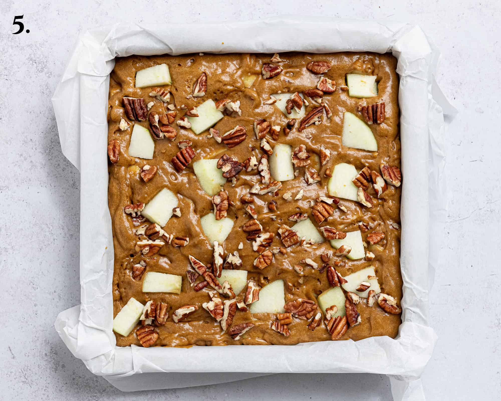 Step 5, the batter with the apples and pecans on top.