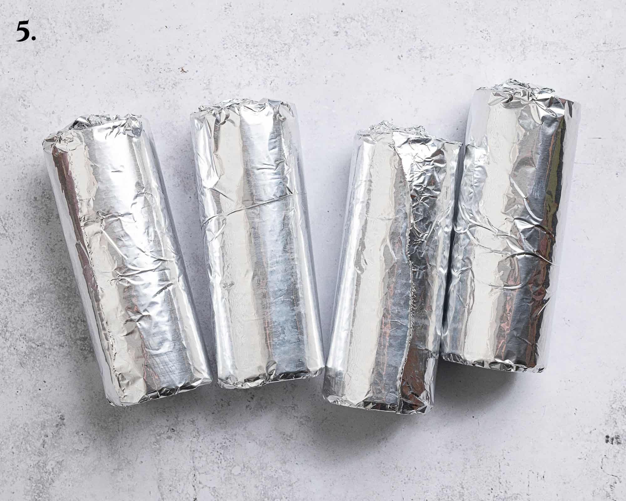 Step 5, empty drinks cans coated in foil.