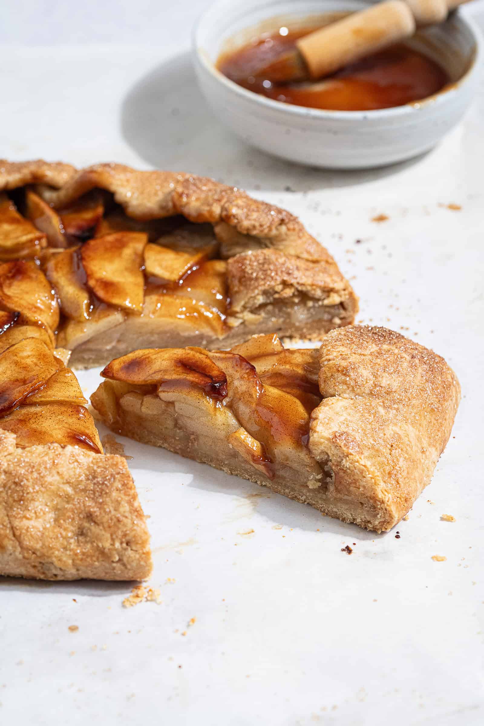Close up shot of a slice of vegan apple galette.