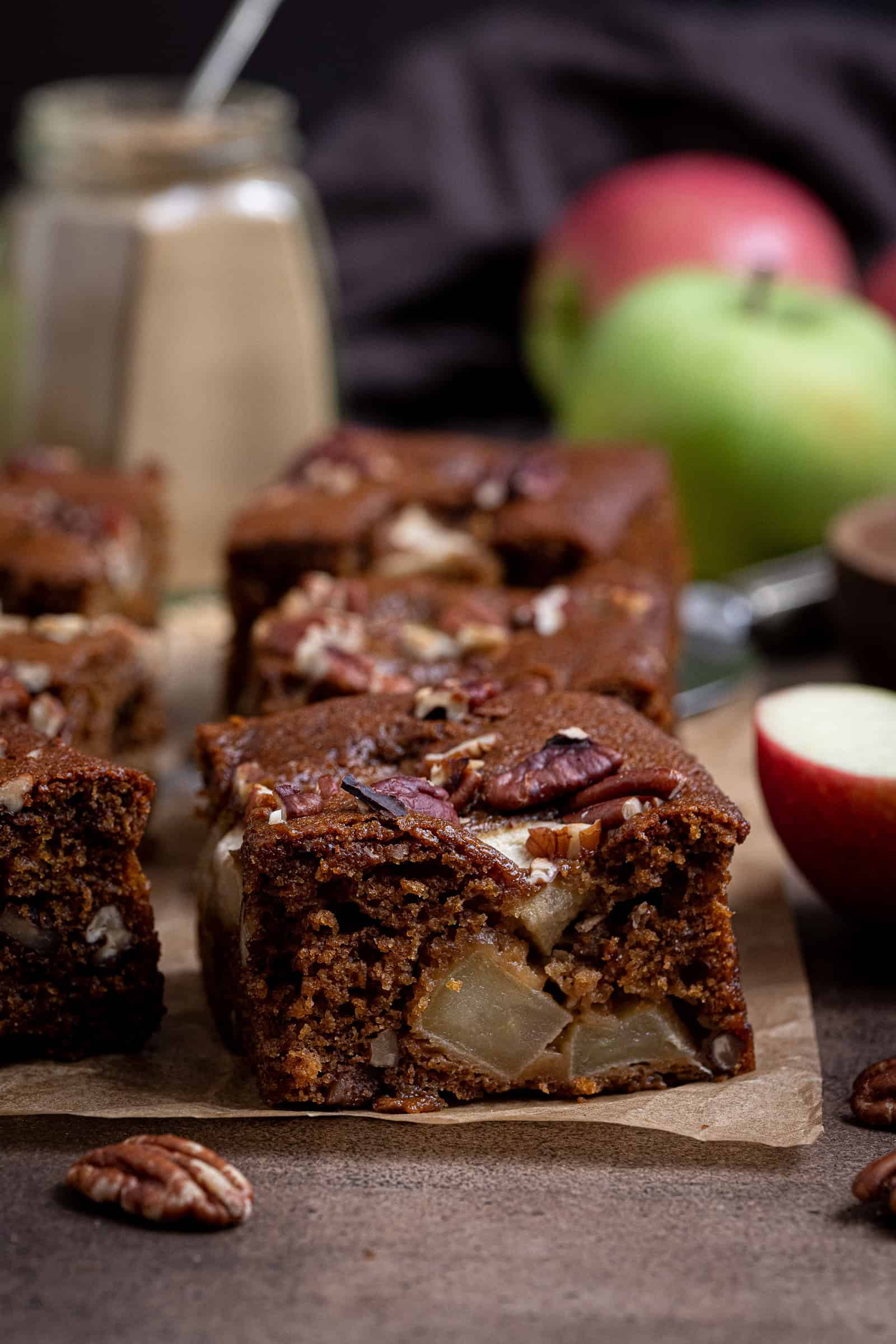 Close up of a slice of vegan apple gingerbread cake.