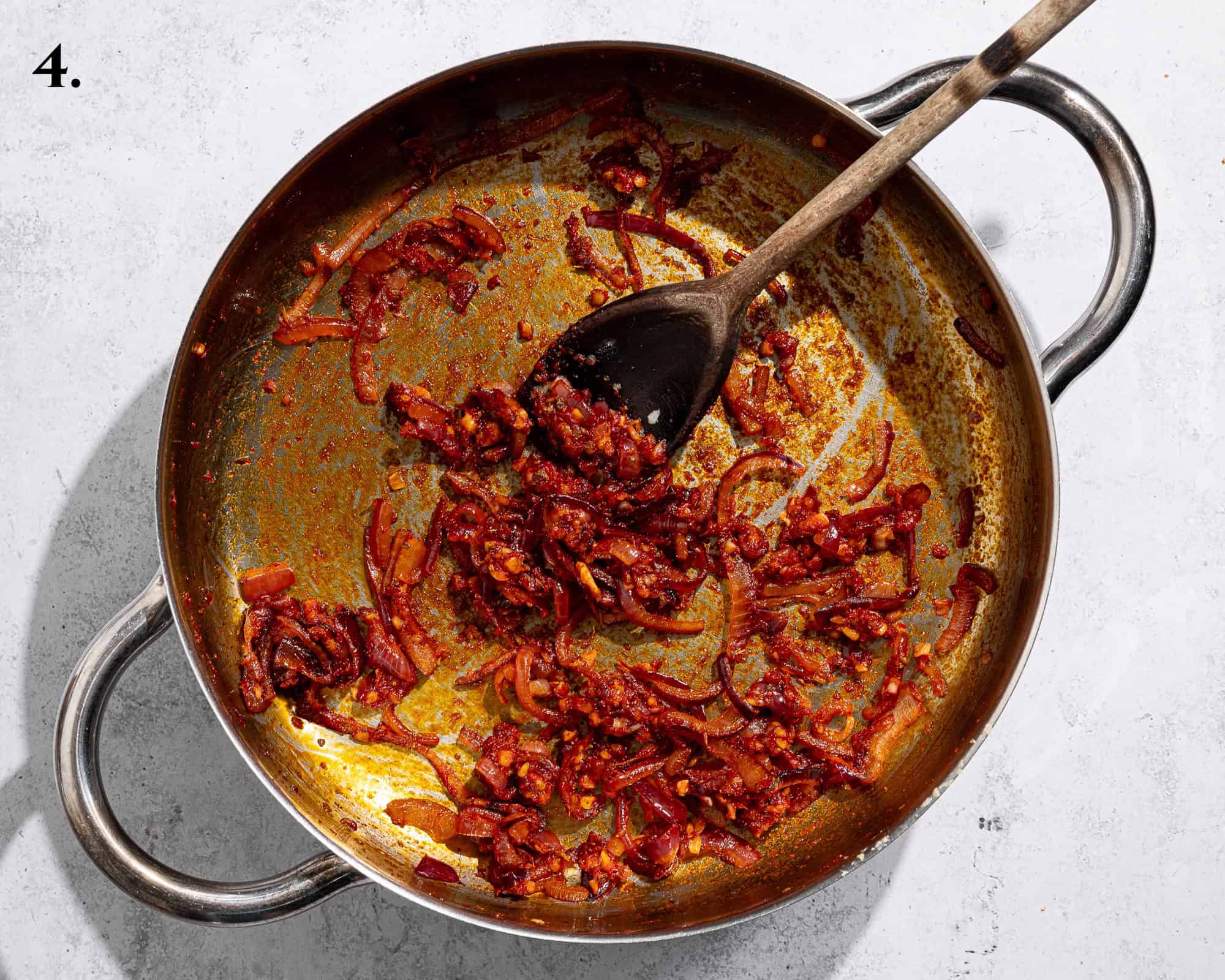 Step 4, the onion with the tomato paste and spices added.