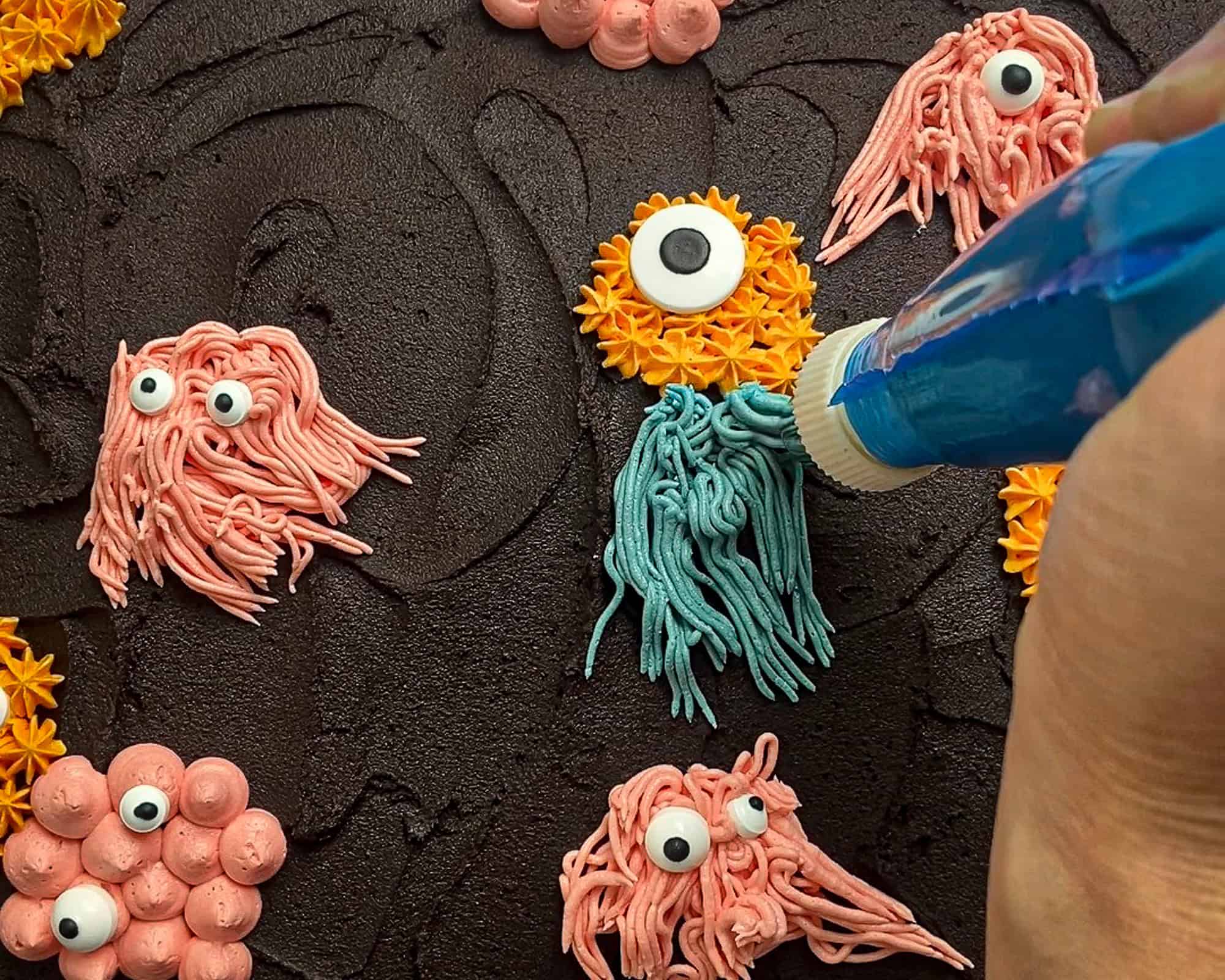 Close up shot of a buttercream monster being piped.