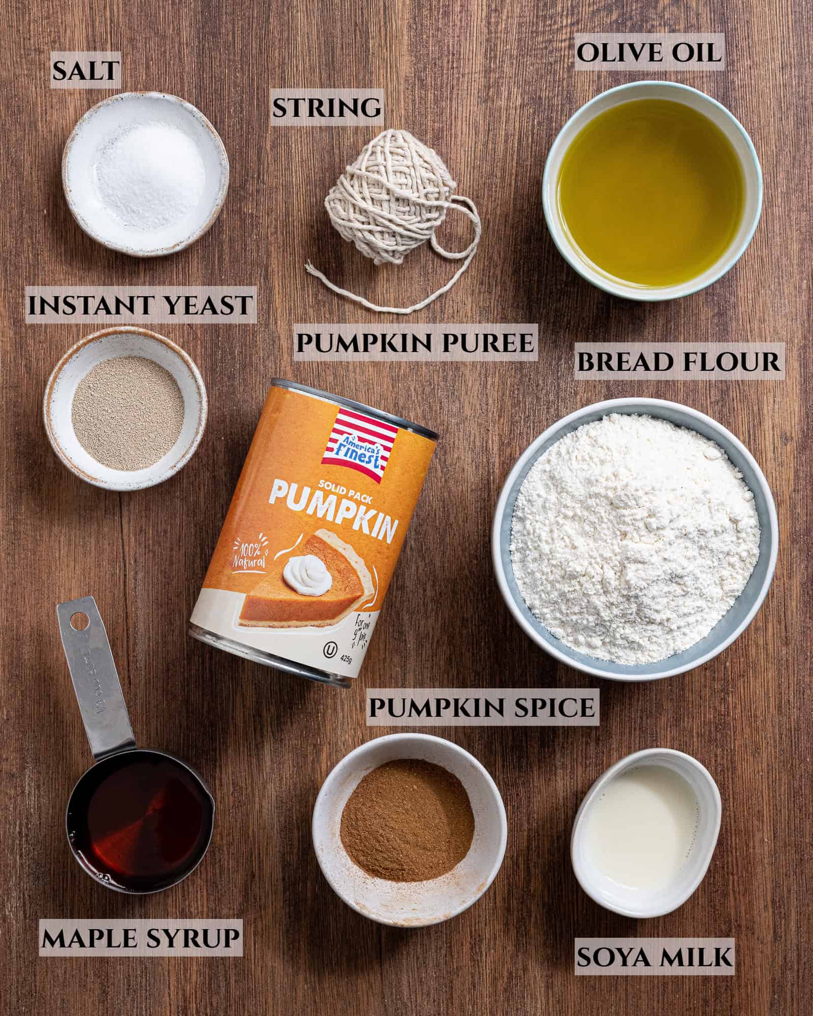 A labelled photo of the ingredients needed to make pumpkin shaped pumpkin bread.