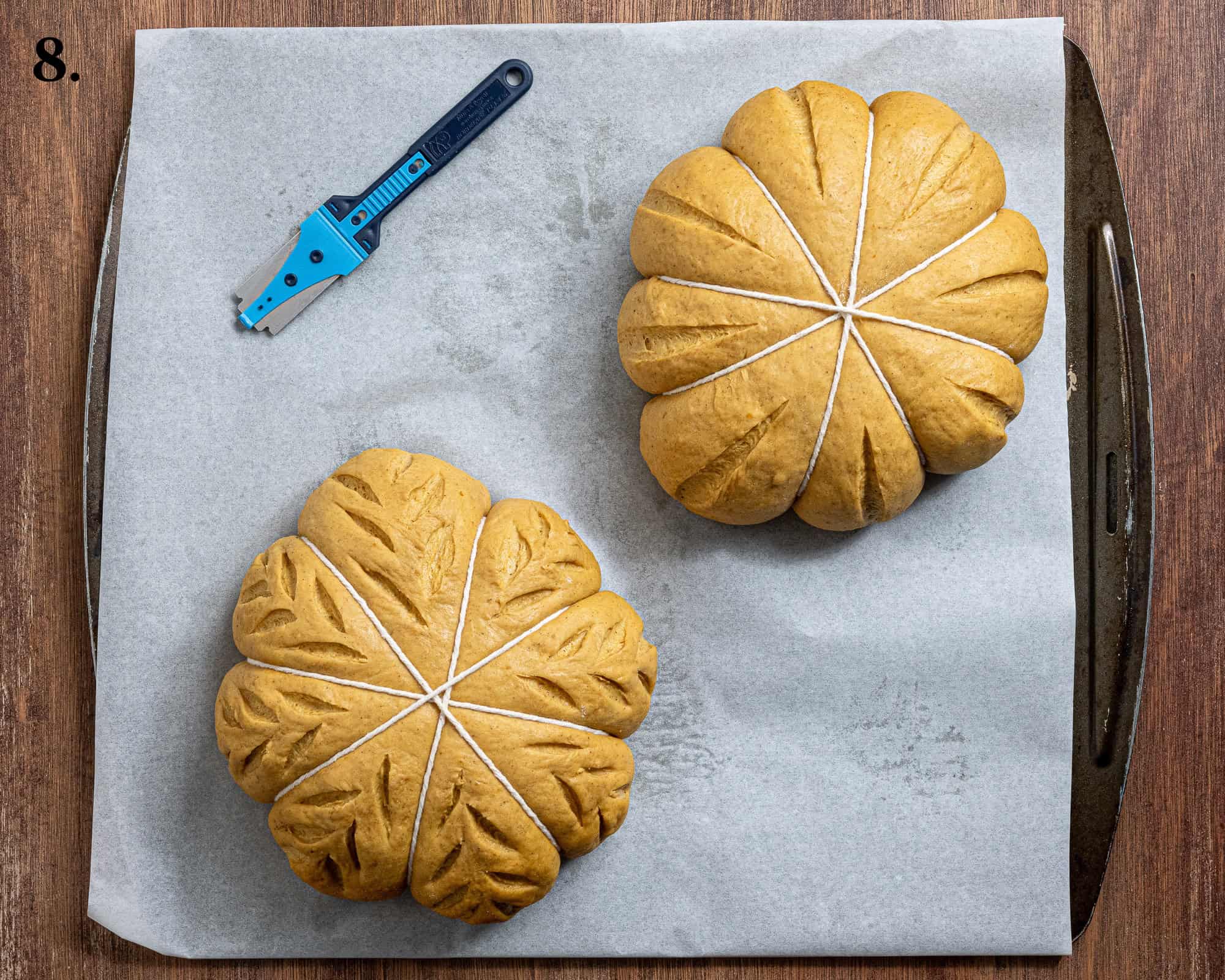 Step 8, the loaves after being slashed with a lame.