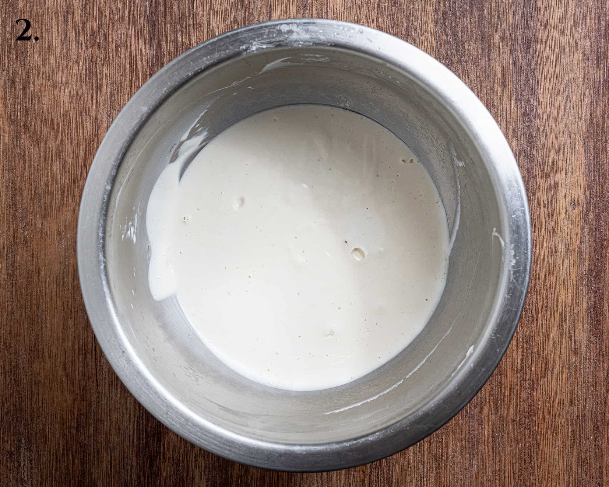 Step 2, the blended cheesecake filling in a bowl.