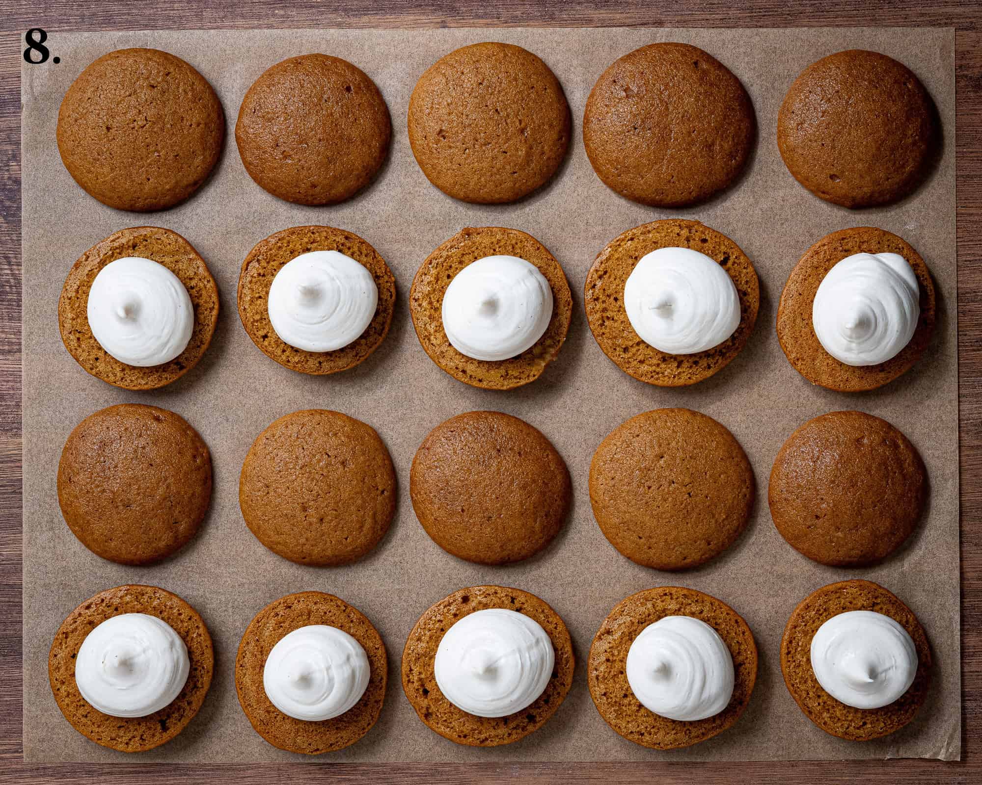 Step 8, rows of the whoopie pie cakes with the cheesecake piped onto half of them.