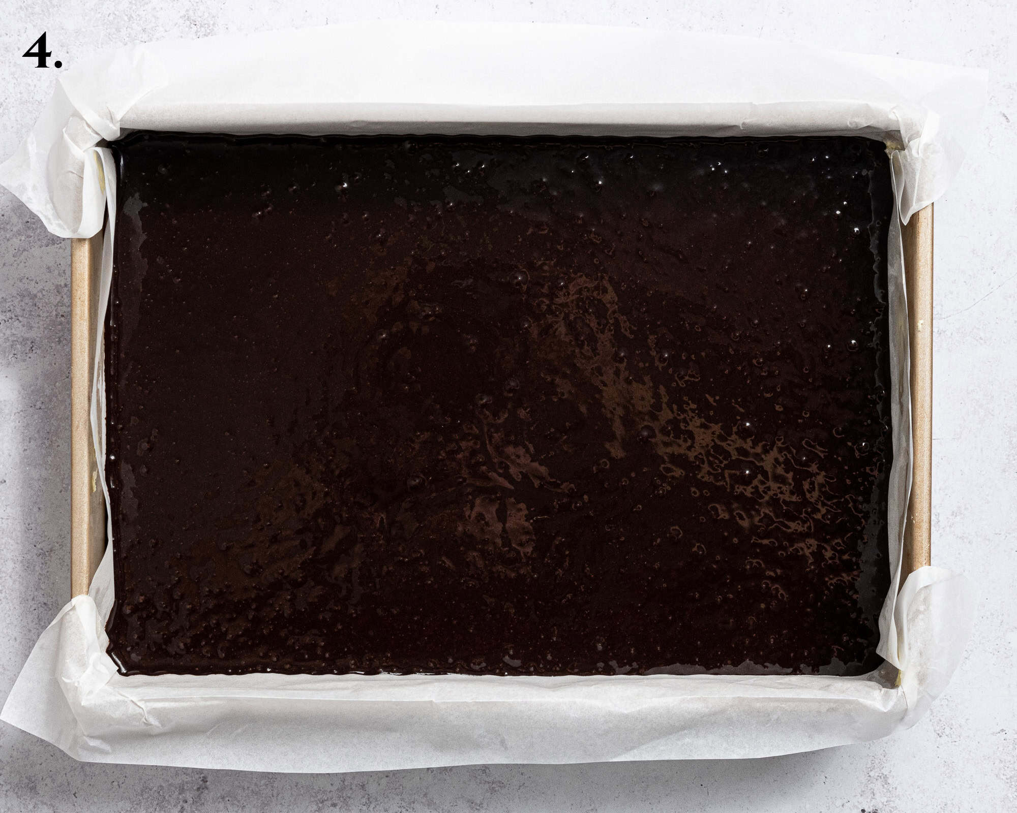 Step 4, the batter with the coffee added, in the cake tin.