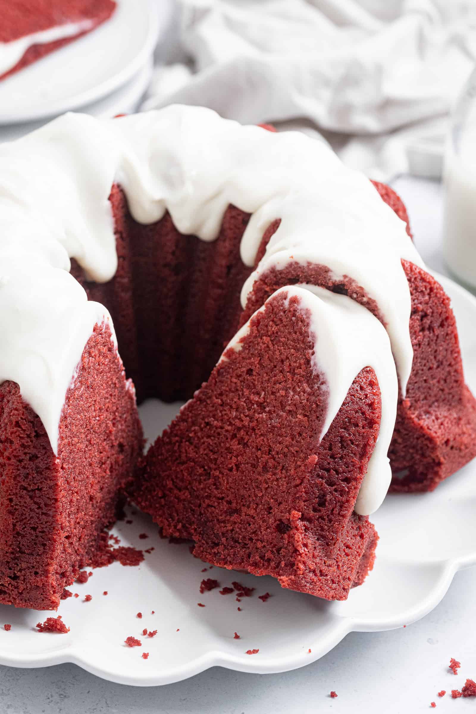 Close up shot of a slice of vegan red velvet bundt cake.